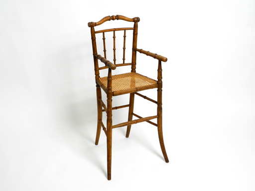 French highchair for a child from the 1930s made of bentwood with Viennese wicker seat