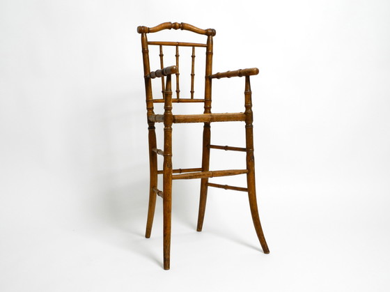 Image 1 of French highchair for a child from the 1930s made of bentwood with Viennese wicker seat