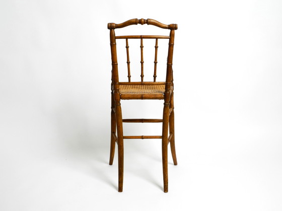 Image 1 of French highchair for a child from the 1930s made of bentwood with Viennese wicker seat