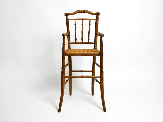 Image 1 of French highchair for a child from the 1930s made of bentwood with Viennese wicker seat