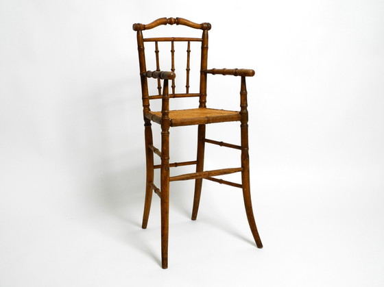 Image 1 of French highchair for a child from the 1930s made of bentwood with Viennese wicker seat