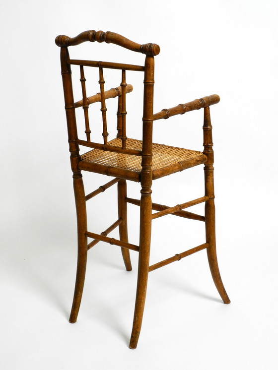 Image 1 of French highchair for a child from the 1930s made of bentwood with Viennese wicker seat