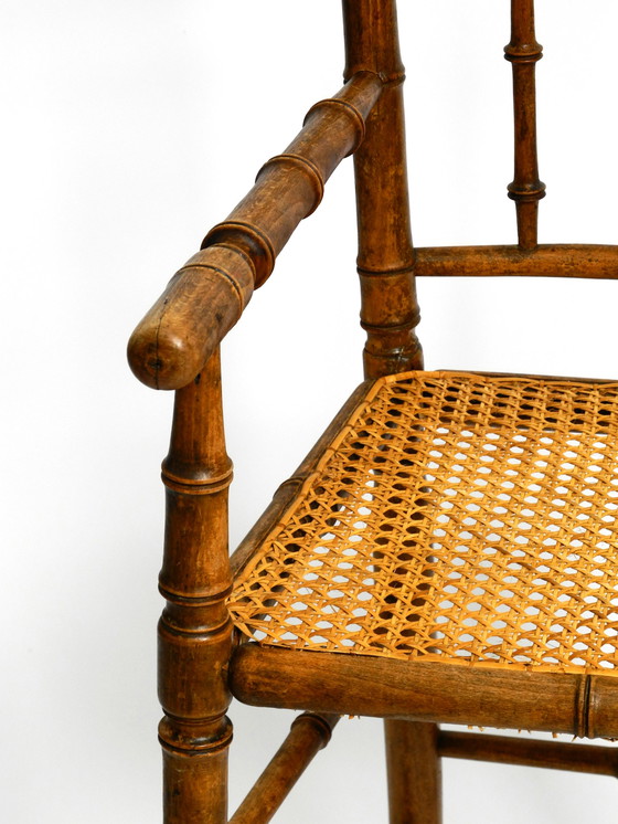 Image 1 of French highchair for a child from the 1930s made of bentwood with Viennese wicker seat