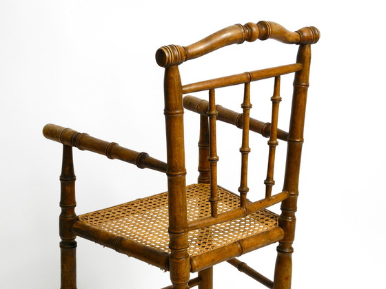 Image 1 of French highchair for a child from the 1930s made of bentwood with Viennese wicker seat