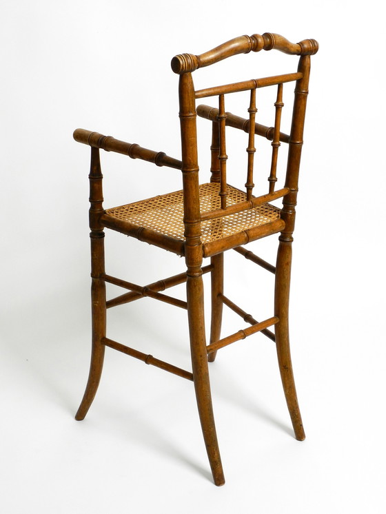 Image 1 of French highchair for a child from the 1930s made of bentwood with Viennese wicker seat