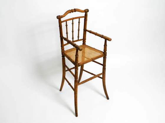 Image 1 of French highchair for a child from the 1930s made of bentwood with Viennese wicker seat