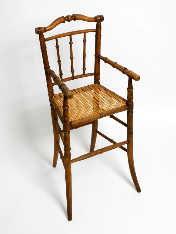 Image 1 of French highchair for a child from the 1930s made of bentwood with Viennese wicker seat