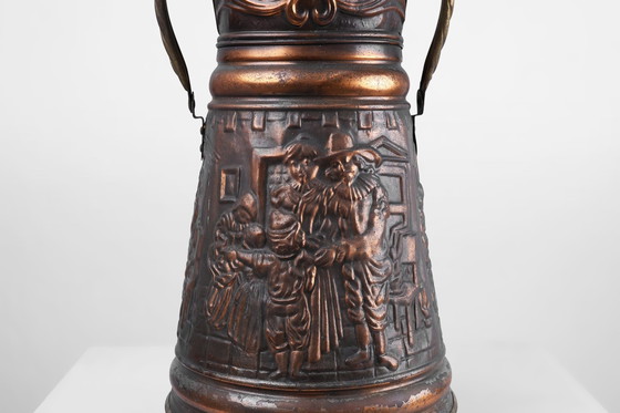 Image 1 of Paragüero de cobre con relieve martillado de una escena familiar medieval, Francia, ca. 1900