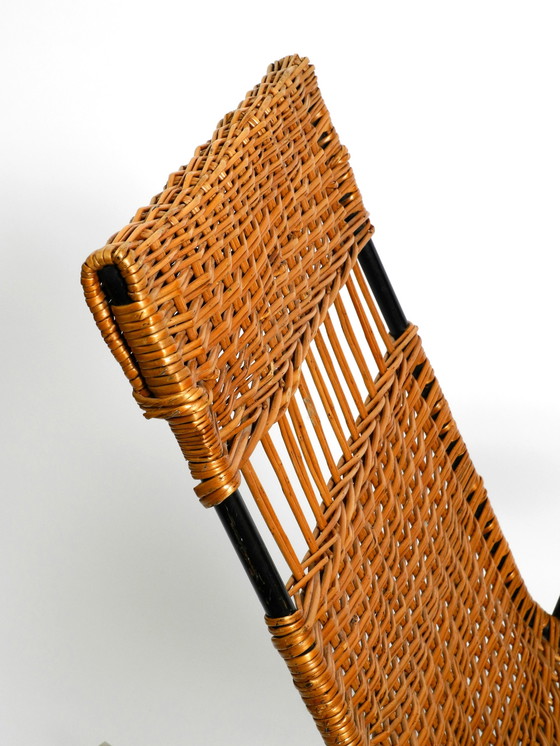 Image 1 of Beautiful Mid Century Modern rocking chair made of black painted metal and rattan