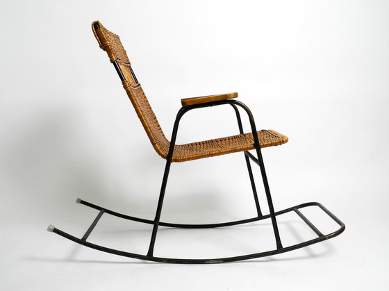 Image 1 of Beautiful Mid Century Modern rocking chair made of black painted metal and rattan