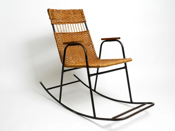 Image 1 of Beautiful Mid Century Modern rocking chair made of black painted metal and rattan