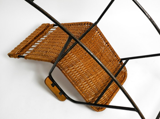 Image 1 of Beautiful Mid Century Modern rocking chair made of black painted metal and rattan