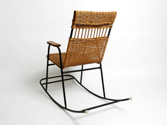 Image 1 of Beautiful Mid Century Modern rocking chair made of black painted metal and rattan