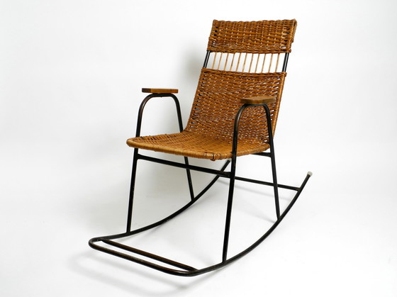 Image 1 of Beautiful Mid Century Modern rocking chair made of black painted metal and rattan