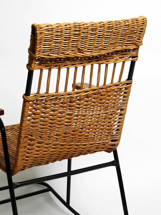 Image 1 of Beautiful Mid Century Modern rocking chair made of black painted metal and rattan