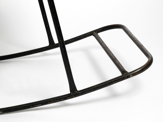 Image 1 of Beautiful Mid Century Modern rocking chair made of black painted metal and rattan