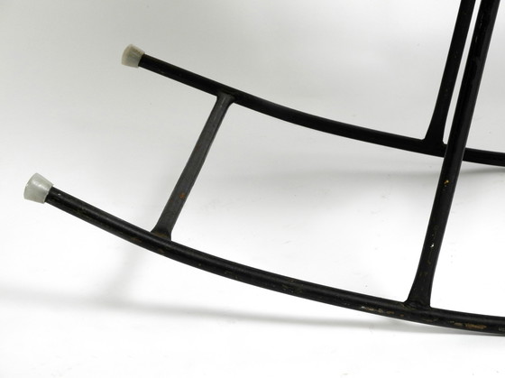 Image 1 of Beautiful Mid Century Modern rocking chair made of black painted metal and rattan