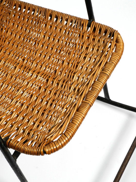 Image 1 of Beautiful Mid Century Modern rocking chair made of black painted metal and rattan