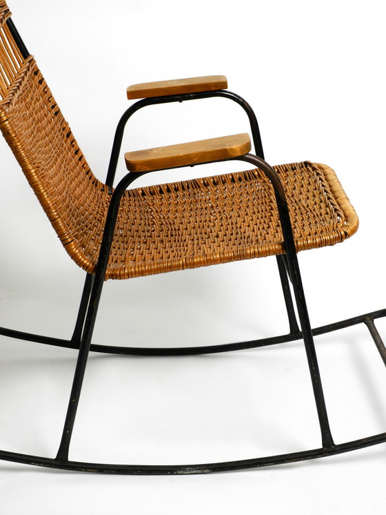 Image 1 of Beautiful Mid Century Modern rocking chair made of black painted metal and rattan