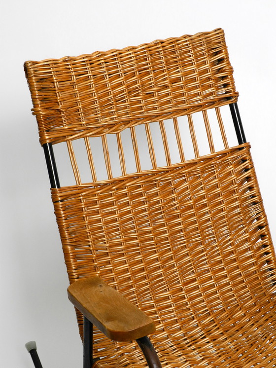 Image 1 of Beautiful Mid Century Modern rocking chair made of black painted metal and rattan