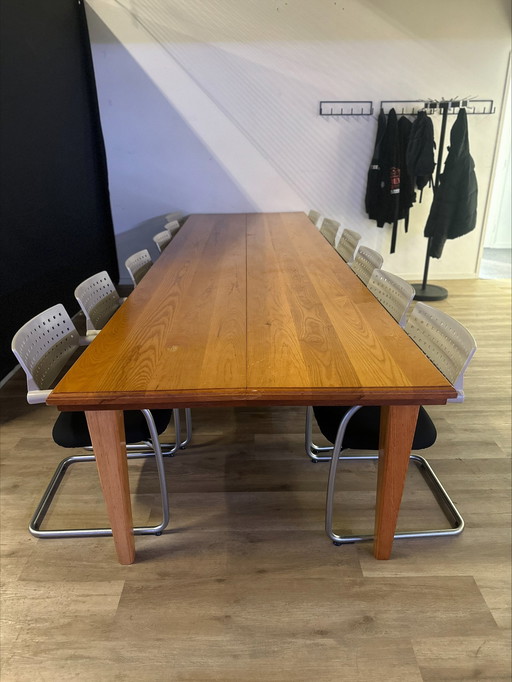 Meeting table with 12 matching chairs