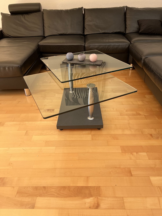 Image 1 of Modern coffee table made of solid, rotating Glass