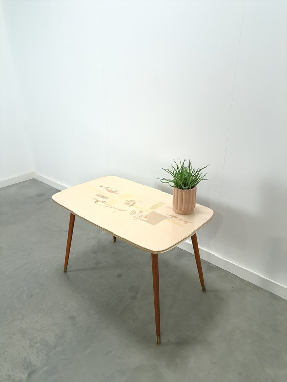 Image 1 of Formica coffee table with brass legs and fish