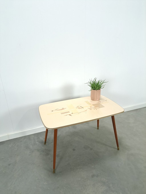 Formica coffee table with brass legs and fish