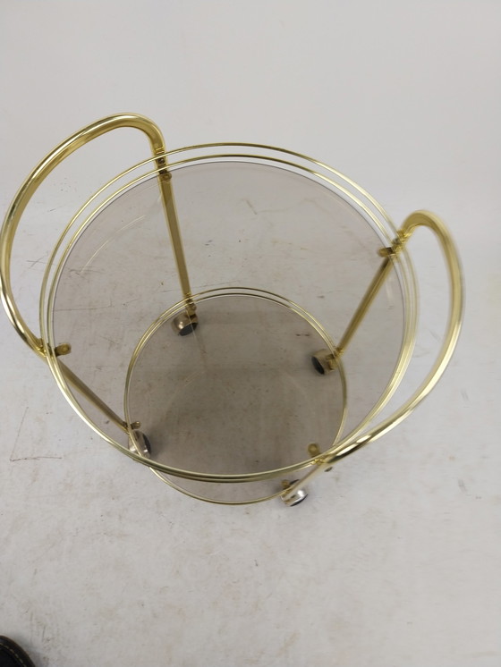 Image 1 of 1 x gold plated beverage trolley 1970's. Smoke glass