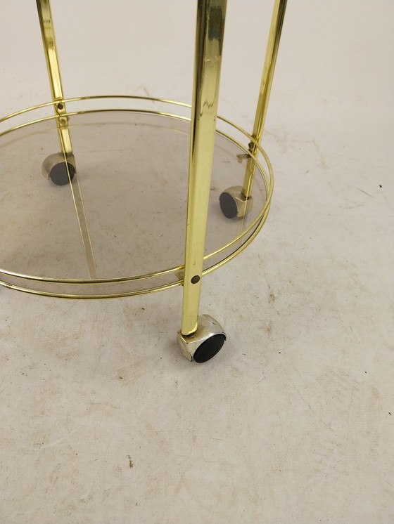 Image 1 of 1 x gold plated beverage trolley 1970's. Smoke glass