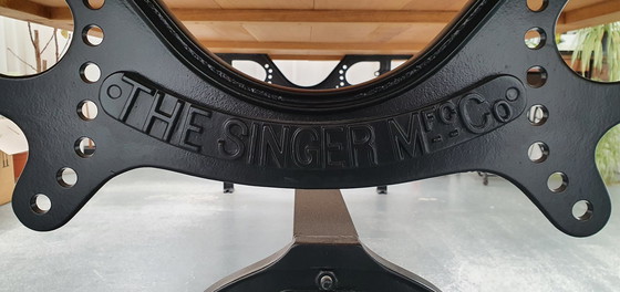 Image 1 of Solid oak table with historic industrial Singer base