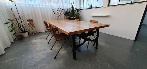 Image 1 of Solid oak table with historic industrial Singer base