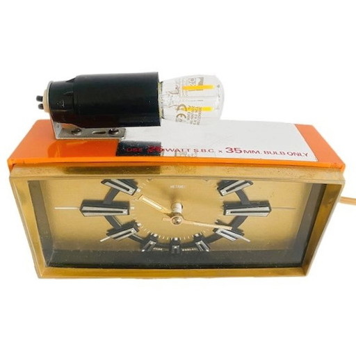 Vintage mid-century Metamec alarm clock orange gold with light