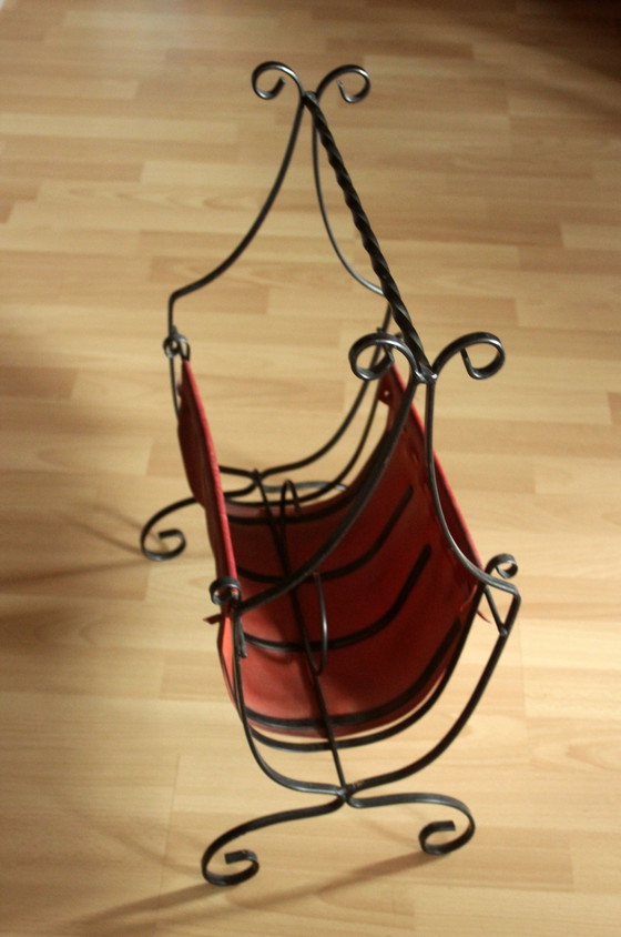Image 1 of Wrought iron magazine rack with dark red leather, vintage