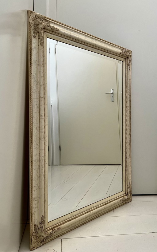 Faceted mirror with frame