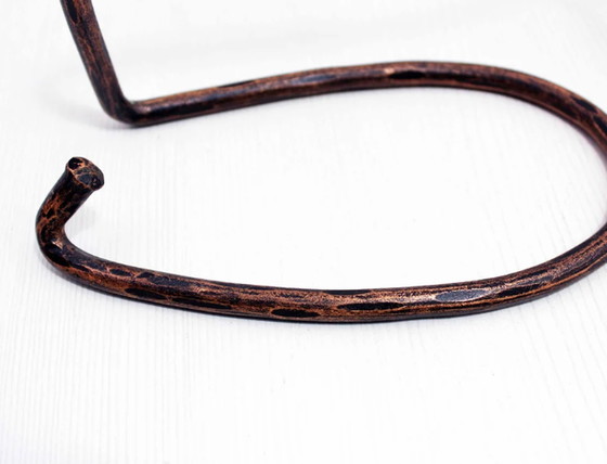 Image 1 of Vintage brass bottle holder in the style of Carl Aubock.