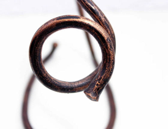 Image 1 of Vintage brass bottle holder in the style of Carl Aubock.