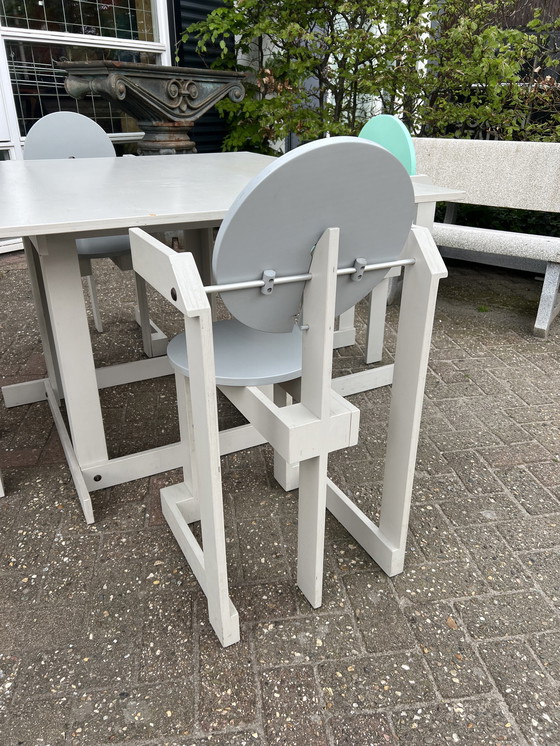 Image 1 of Memphis style table and chairs, Henk Lampe