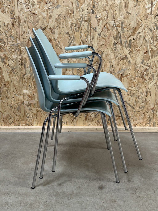 Kartell Maui 3 chairs with armrests.