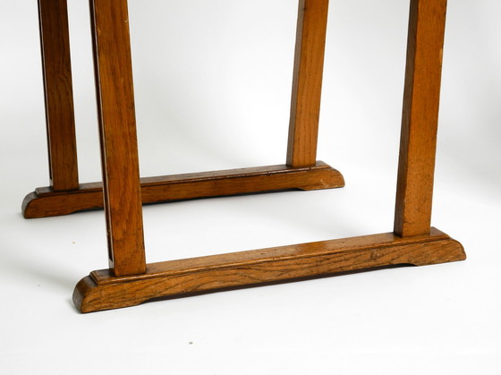 Image 1 of A pair of Mid Century oak chairs with skid feet and wicker seats