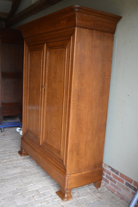 Image 1 of Sleek Antique Oak Louis Philippe Cupboard.