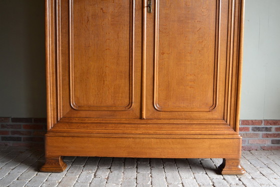 Image 1 of Sleek Antique Oak Louis Philippe Cupboard.