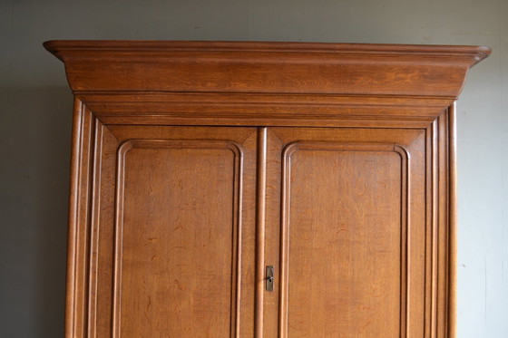 Image 1 of Sleek Antique Oak Louis Philippe Cupboard.