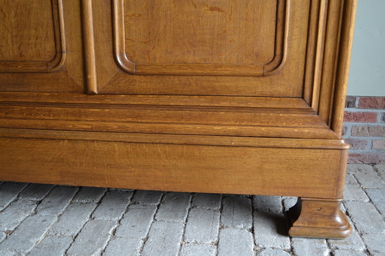 Image 1 of Sleek Antique Oak Louis Philippe Cupboard.