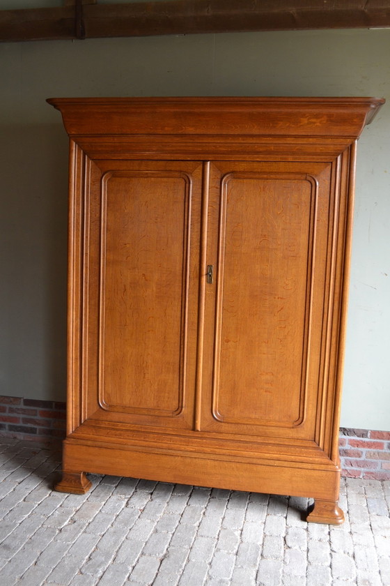 Image 1 of Sleek Antique Oak Louis Philippe Cupboard.