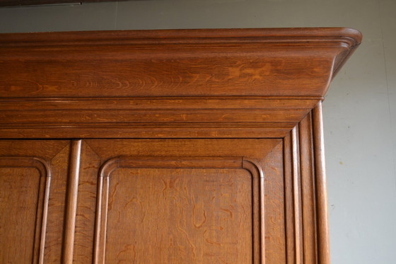 Image 1 of Sleek Antique Oak Louis Philippe Cupboard.