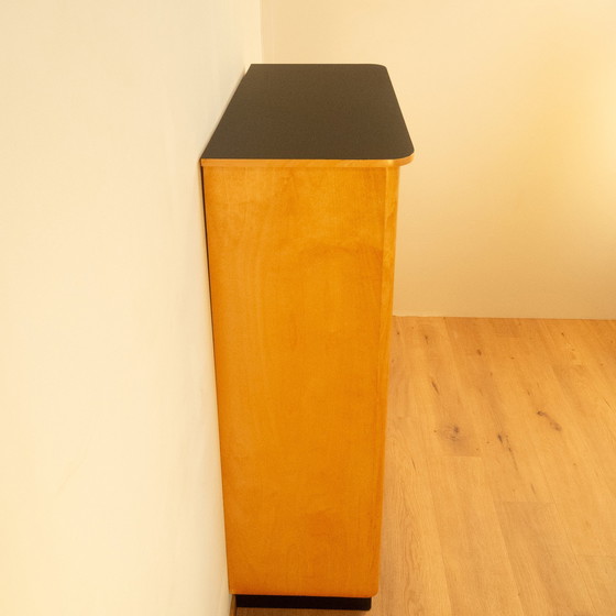 Image 1 of Large chest of drawers, flamed birch with black formica top, 1950s