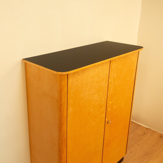 Image 1 of Large chest of drawers, flamed birch with black formica top, 1950s