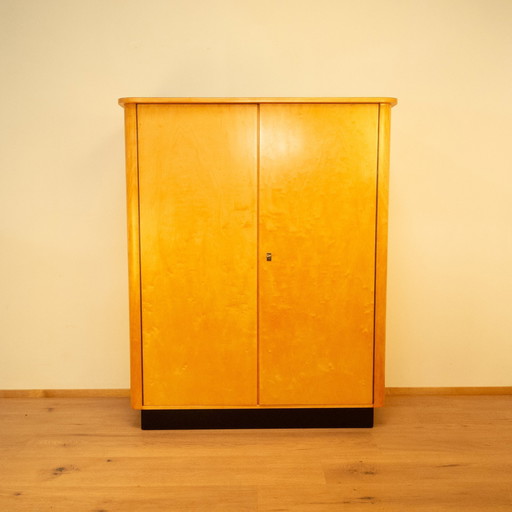 Large chest of drawers, flamed birch with black formica top, 1950s