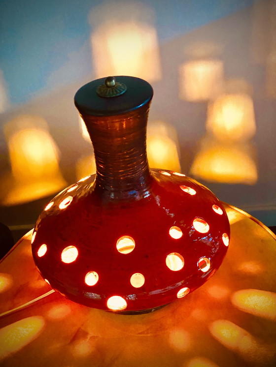 Ceramic lamp with holes top
